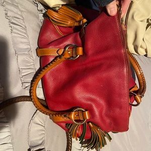 A red leather and green felt Dooney & Burke